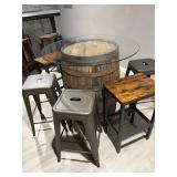 Rustic whiskey barrel bistro table topped with a circular glass surface