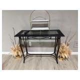 black metal console table with a glass top