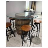 Rustic whiskey barrel bistro table topped with a circular glass surface