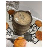 Rustic whiskey barrel bistro table topped with a circular glass surface