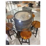 Rustic whiskey barrel bistro table topped with a circular glass surface
