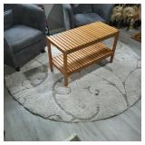 bench with a lower slatted shelf