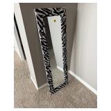 full-length floor mirror featuring a black and white zebra print