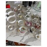 assortment of tea cups and saucers