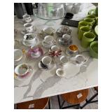 assortment of tea cups and saucers