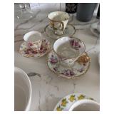 assortment of tea cups and saucers