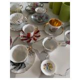 assortment of tea cups and saucers