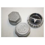   VINTAGE AUTO GREASE CAPS AND CAR EMBLEM
