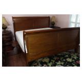 View 2: Mahogany Kingsize Sleigh Bed.  Safavieh  8’ Round Black Floral Area Rug shown in Foreground.