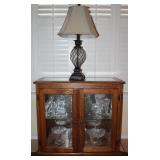 Oak Frame Small Double Door Glass Credenza (30”H x 32”W x 14”D).  Show with Metal and Glass Table La