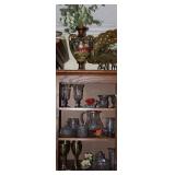 Exterior Cabinet of Entertainment Center showing contents of  Miscellaneous Crystal, Bisque Flowers 