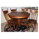 Antique Oak  48"  Round Pedestal Table and 4 Antique Oak Spindle/Press Back Rabbit Ear Chairs. Shown