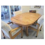 OAK TABLE/ 2 END DRAWERS + 4 CASTOR CHAIRS