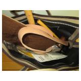 bag full of leather tools and instructions, supplies