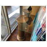 Glass top table with column base