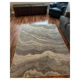 Gray High-Back Chair with Area Rug