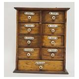 1063	HANGING WOODEN SPICE RACK, ALL ORIGINAL W/ALL KNOBS & LABELS, 9 7/8 IN WIDE X 11 5/8 IN HIGH X 