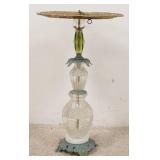 1117	GLASS & METAL SMALL STAND EMBOSSED TOP IS COPPER W/ A BRASS RIM. TOP IS 14 IN DIAMETER 23 IN H	