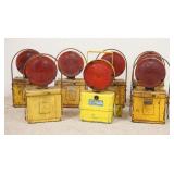 1123	7 BATTERY OPERATED RAILROAD SIGNAL LIGHTS, SIX HAVE RED LENSES ONE MARKED STAR FLASHER HAS RED 