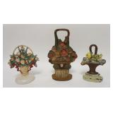 1152	GROUP OF 3 CAST IRON FLOWER BASKET DOOR STOPS, LARGEST IS 12 IN HIGH	50	100	25	PLEASE PAY ATTEN