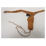 1172	ANTIQUE TOY WESTERN CAP GUNS IN  HOLSTER MARKED MARVEL, MAVERICK TOY CAP GUN MARKED FLIP	50	100