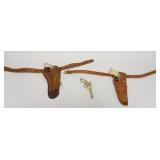 1182	GROUP OF 3 ANTIQUE TOY CAP GUNS, 2 IN HOLSTERS, 1 LEATHER BELT WITH DISNEY CHARACTERS	50	100	25