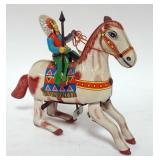 1187	ANTIQUE TIN WIND UP TOY INDIAN CHIEF RIDING HORSE, 1 LEATHER EAR MISSING ON HORSE, SPRING GOOD 
