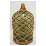 1205	LARGE GREEN GLASS BOTTLE W/ WOVEN ROPE HOLDER. 22 1.2 IN H 11 IN DIAMETER 	50	100	20	PLEASE PAY