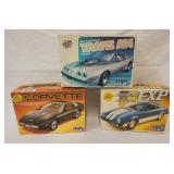 1033	LOT OF 3 MPC MODEL CAR KITS, CORVETTE, FORD EXP, TRANS AM, KITS ARE POSSIBLY COMPLETE, NOT GUAR