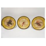 1126	THREE 12 1/4 IN POTTERY PLATES W/ FLY FISHING LURE DECORATION. TWO OF THE PLATES HAVE SMALL RIM