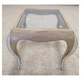 1157	MODERN GLASS TOP LAMP TABLE HAS INLAID PATTERN ON THE LEGS TOP GLASS IS BEVELED. 27 1/2 IN X 24