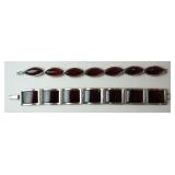 1244	2 STERLING SILVER DEEP AMBER STONE BRACELETS, BOTH MARKED 925. OVAL STONE BRACELET IS APPROXIMA