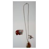1247	STERLING SILVER ELEPHANT PIN WITH DEEP AMBER STONE MARKED 925 AND STERLING SILVER NECKLACE WITH