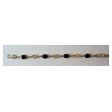 1265	VAN DELL GOLD FILLED ONYX BRACELET, APPROXIMATE WEIGHT WITH STONES IS 6.191 GRAMS	50	100	25	PLE