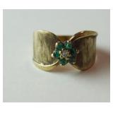 1277	MARKED 14K GOLD RING WITH 6 EMERALDS AND DIAMOND FLOWER, STONES UNTESTED. APPROXIMATE WEIGHT WI