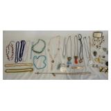 1051	LARGE LOT OF COSTUME JEWELRY INCLUDING NECKLACES, CLIPS AND MORE