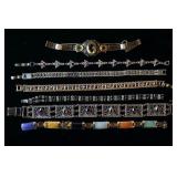 1057	LOT OF SEVEN BRACELETS W/ COLORFUL STONES/GEMSTONES. SOME BRACELETS MAY HAVE DAMAGE. AS FOUND. 