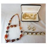 1060	LOT OF COSTUME JEWELRY. LOT INCLUDES A NECKLEACE & EARRING SET, A BRACELET, A PAIR OF EARRINGS 