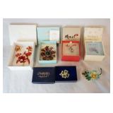 1068	LOT OF SIX SIGNED BROOCH PINS, LOT INCLUDES A FLORAL BROOCH PIN & CLIP ON EARRINGS SET BY ALANA