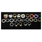1072	LOT OF 24 COSTUME JEWELRY RINGS, LOT INCLUDES ONE MARKED JAPAN & ONE SIGNED HEIDI DAUS. AS FOUN