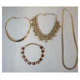1088	LOT OF FOUR NECKLACES LONGEST IS APP.  28 IN. AS FOUND.