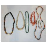 1102	LOT OF FIVE NECKLACES & A BRACELET. LOT INCLUDES FOUR NECKLACES & A COLORFUL NECKLACE & MATCHIN