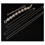 1114	LOT OF STERLING SILVER JEWELRY INCLUDING THREE NECKLACES & TWO BRACELETS. ONE OF THE NECKLACES 