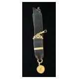 1153	SIGNED E. DROPSY PENDANT. PENDANT TESTS POSITIVE FOR 14K 