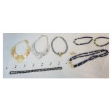 1183	LOT OF COSTUME JEWELRY LOT IINCLUDES A BEADED NECKLACE W/ A LIONS HEAD PENDANT, A BEADED NECKLA