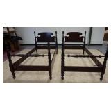 1014	PAIR OF CARVED MAHOGANY TWIN BEDS, TURNED FEET, LEAF CARVED FINIALS,HEADBOARD IS 42 1/2 IN HIGH