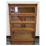 1017	OAK 4 SECTION BARRISTER BOOKCASE, ONE GLASS IS BROKEN, 34 IN WIDE X 56 IN HIGH