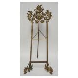 1034	ORNATE BRASS TABLE TOP EASEL, HAS LADIES, FRUIT BASKET, ETC, 13 1/4 IN X 30 1/2 IN