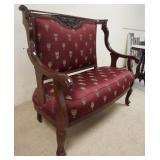 1042	CARVED MAHOGANY SETTEE W/CURVED ARMS, 50 IN WIDE X 44 IN HIGH