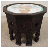 1054	CARVED 10 SIDED STAND W/HAND PAINTED PORCELAIN TOP, 18 IN TOP X 15 IN HIGH